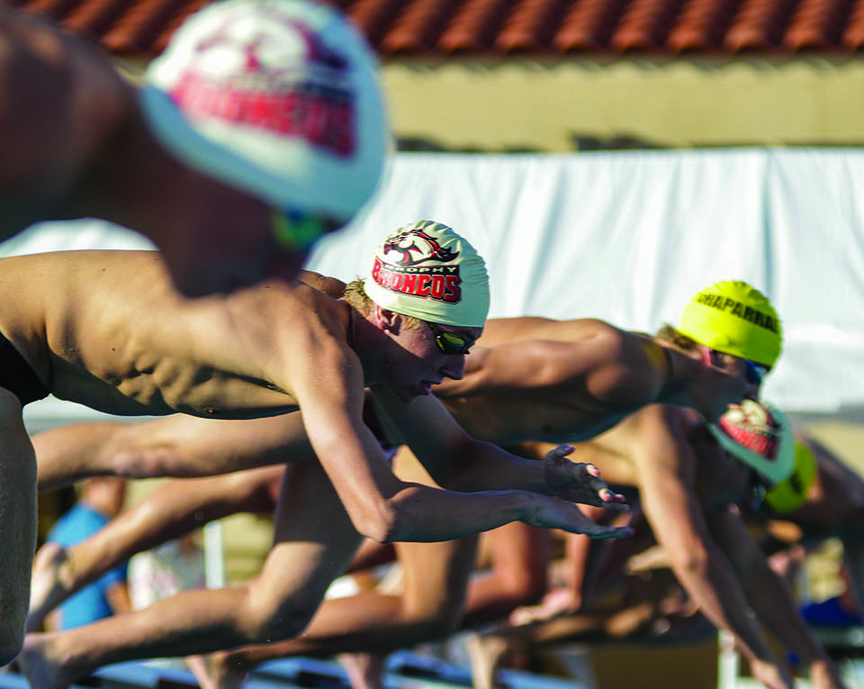 Photo by Ben Lui '15 -- Brophy swimmers compete in a meet earlier in the school year.