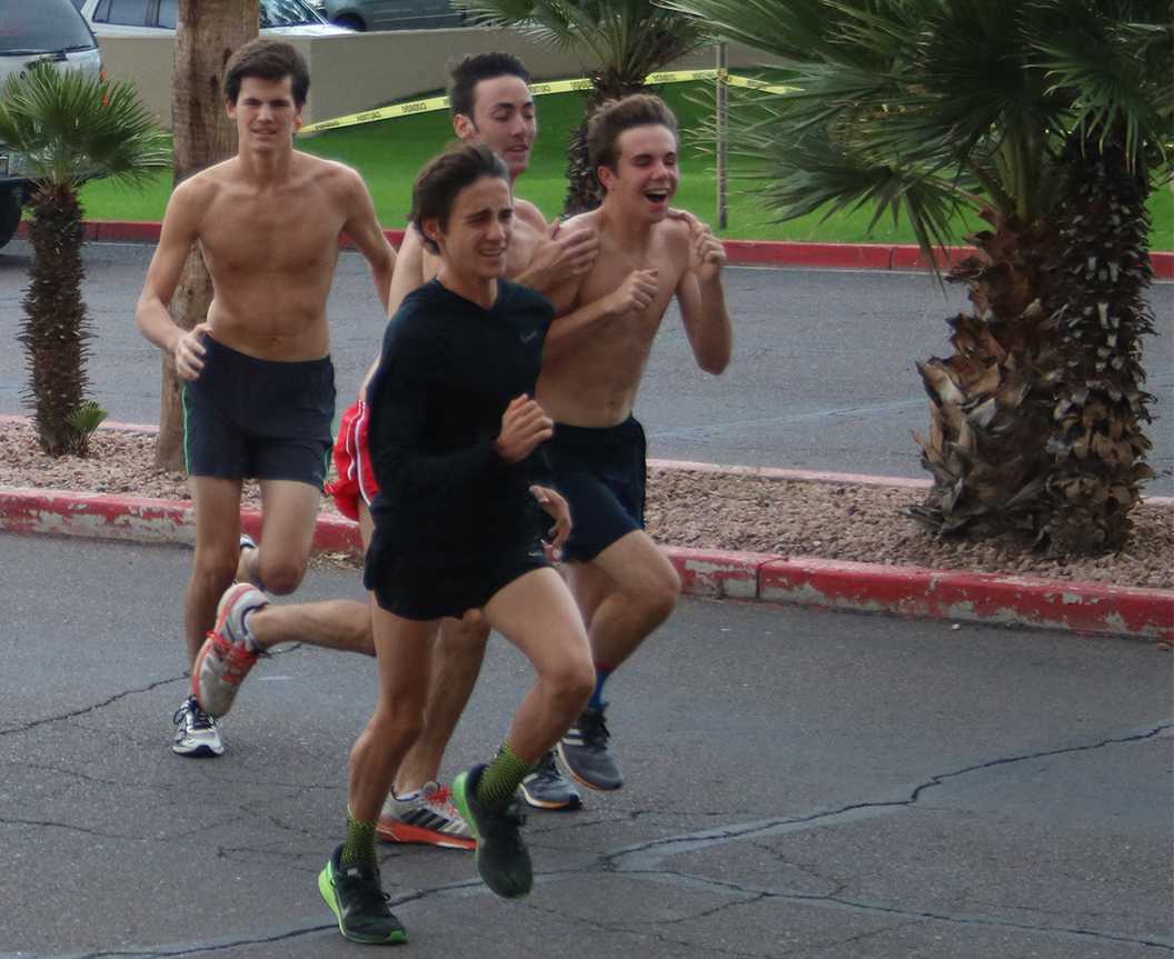 Photo by Bryce Owen ’17 - Drew Burns ’18 (right) enthusiastically runs with his teammates at practice on Oct. 29.