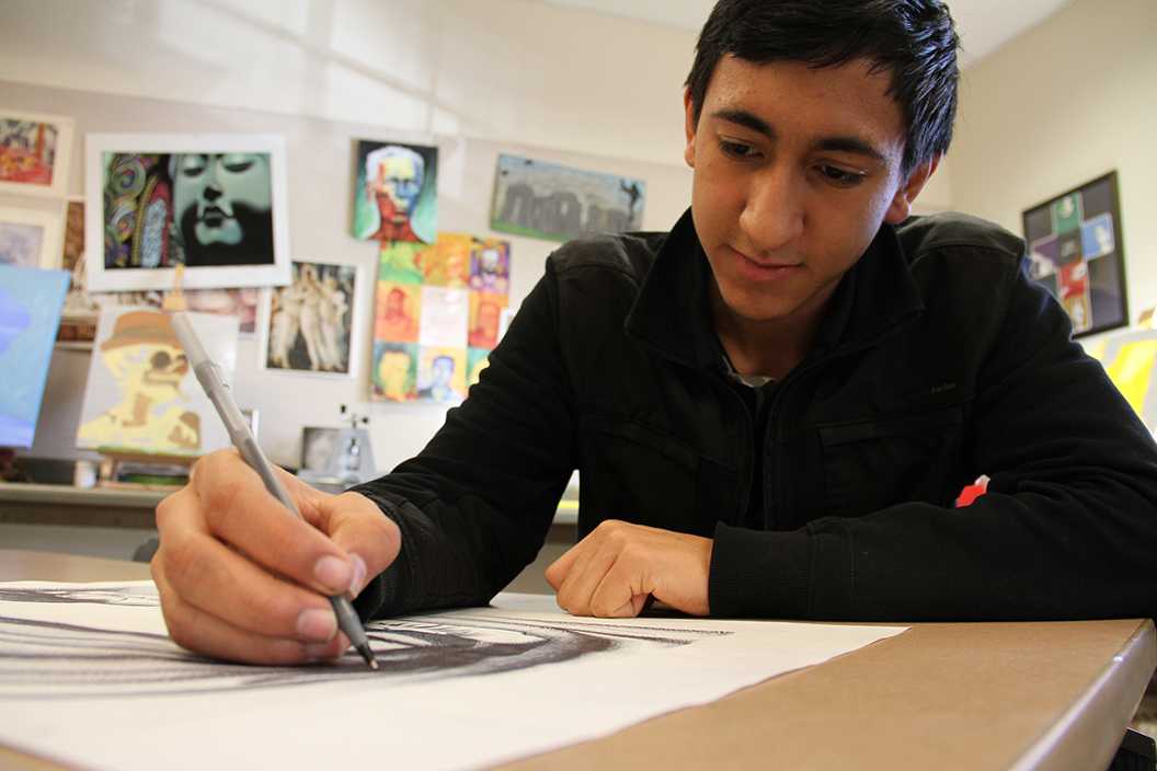 Photo by Isaac Myers ’18 - Alberto Cardona ’16 works on his latest piece in the Studio Art Room, Jan. 15. Cardona has submitted several pieces to BLAM and has won several awards for his art.