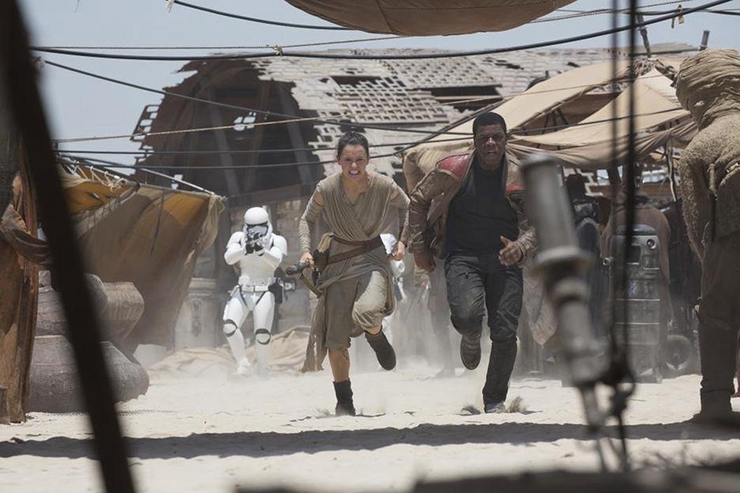 Photo courtesy of Tribune News Service - Daisy Ridley and John Boyega in Star Wars: The Force Awakens.