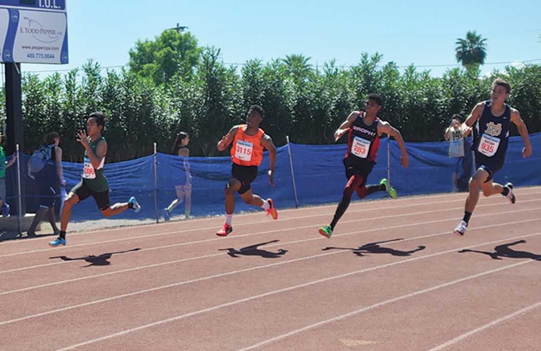Photo by Roberto Aponte 17 -- Robert Brooks 17 (second from right) competes in the 200 meter race at the Chandler Rotary Invitational Meet on April 21, 2015. The track team is looking forward to the long distance events this upcoming season.