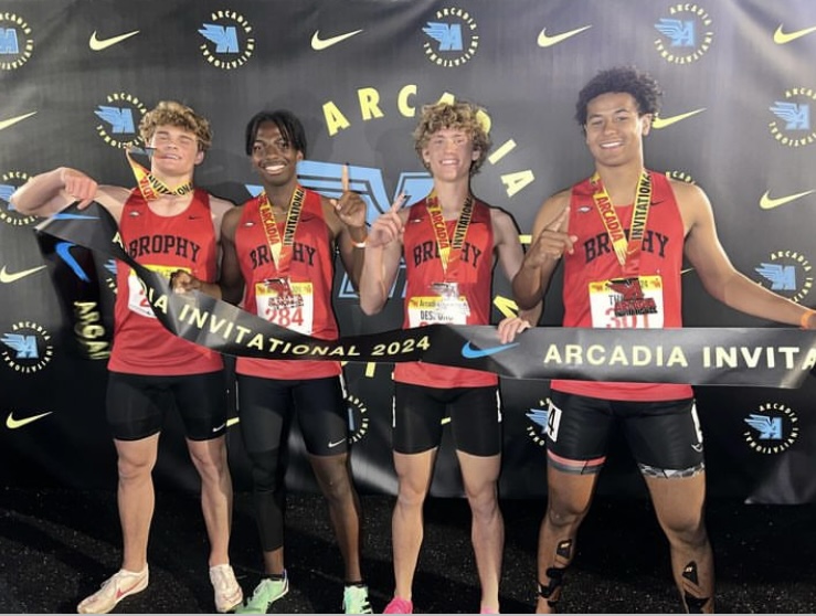 (From left to right) Jack Sebald '24, Darius Alberty '25, Will De Spong '25 and Cree Thomas '25 after winning the 4x100 Shuttle Hurdle Relay at Arcadia Invitational, running a time of 101.76 seconds.