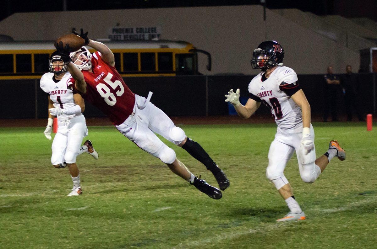 Photo by Noah Rodriguez 17 | Matthew Kempton 17 makes a leaping catch Sept. 4 against Liberty. Brophy defeated Liberty High School 31-10.