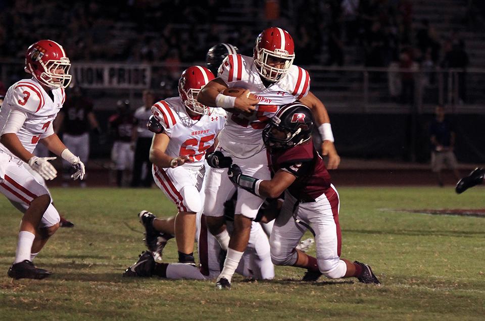 Photo by Devin McManimon McNally 17 | Ryan Velez 16 runs the ball Sept. 11 against Red Mountain. Brophy defeated Red Mountain 22-18.