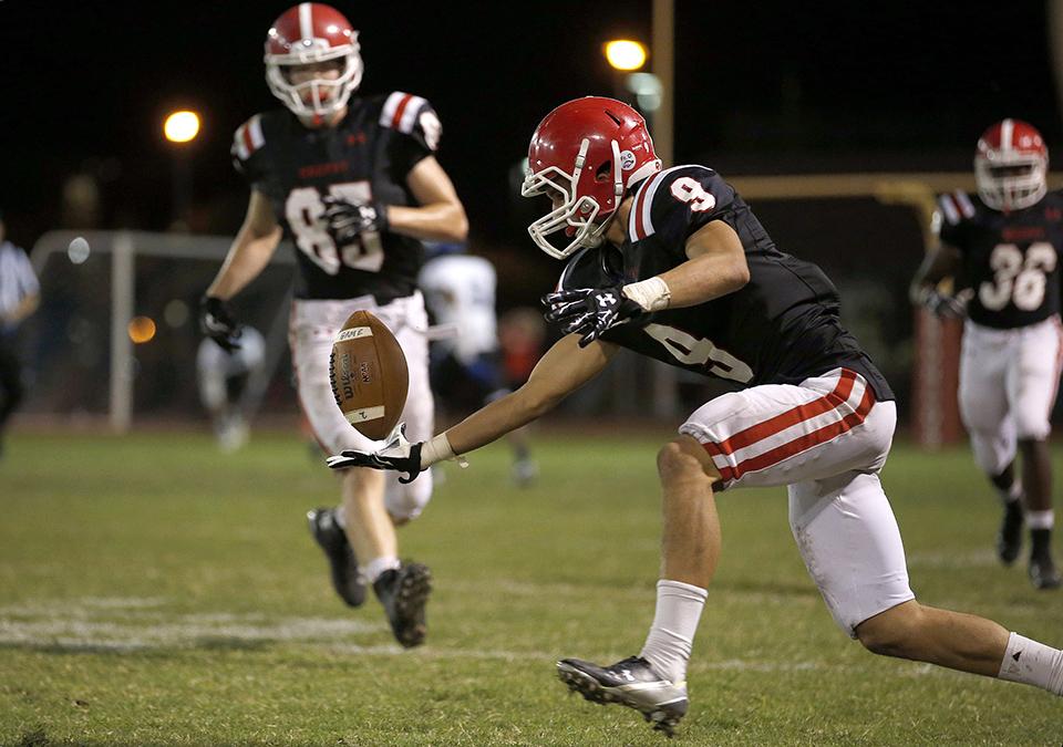 Photo by Hunter Franklin 19 | A pass bounces out the hand of Jimmy Hawkins ’16 Oct. 23 against Chandler High School. The Chandler Wolves defeated the Brophy Broncos 28-6 during Brophy’s Homecoming and Senior Night at Phoenix College.
