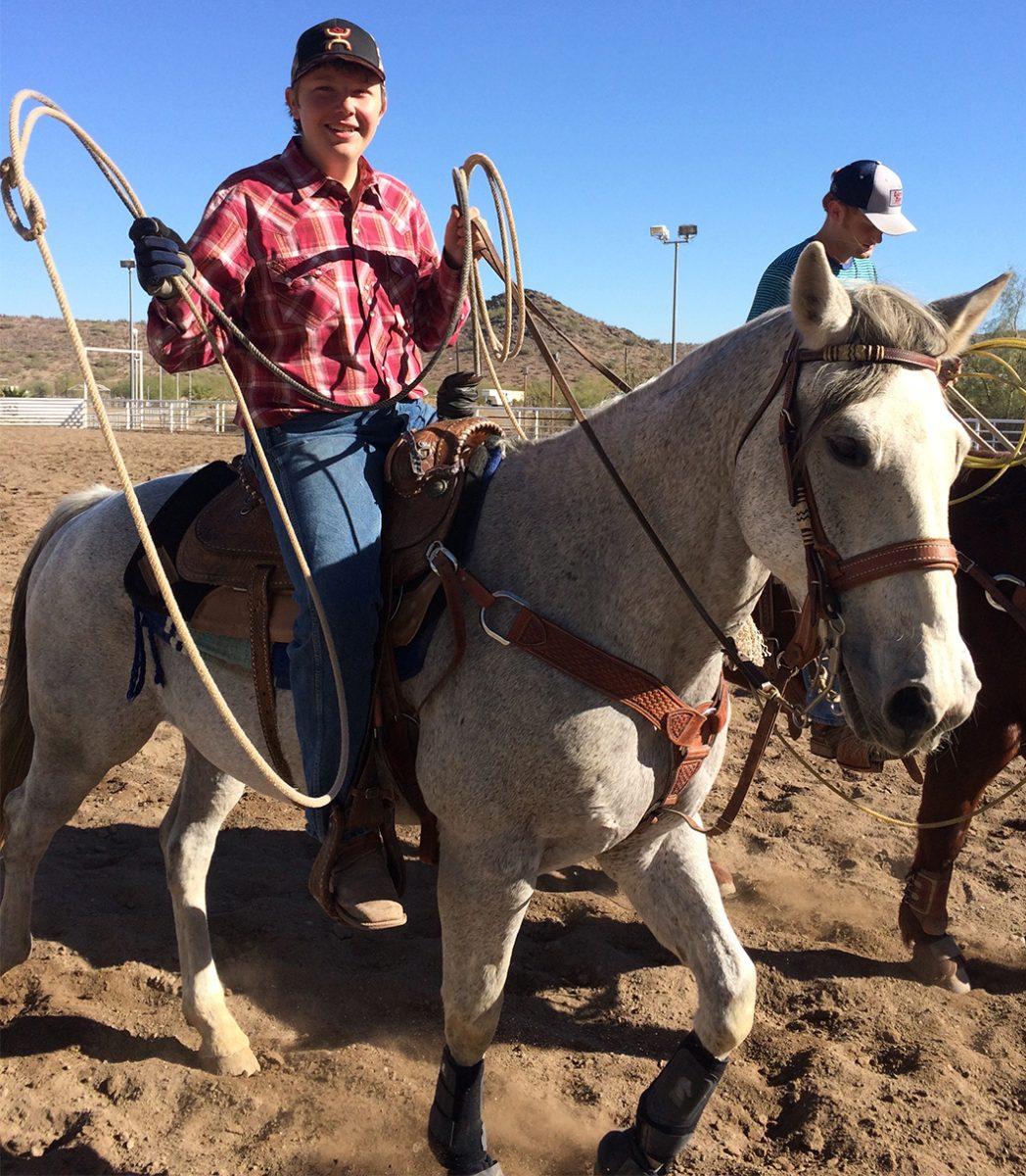 Photo+by+Andrew+Brown+%E2%80%9918+-+Charlie+Regester+%E2%80%9918+prepares+to+rope+a+bull+at+a+local+ranch.+Regester+has+been+roping+since+sixt+grade+and+has+had+success+in+his+competitions.
