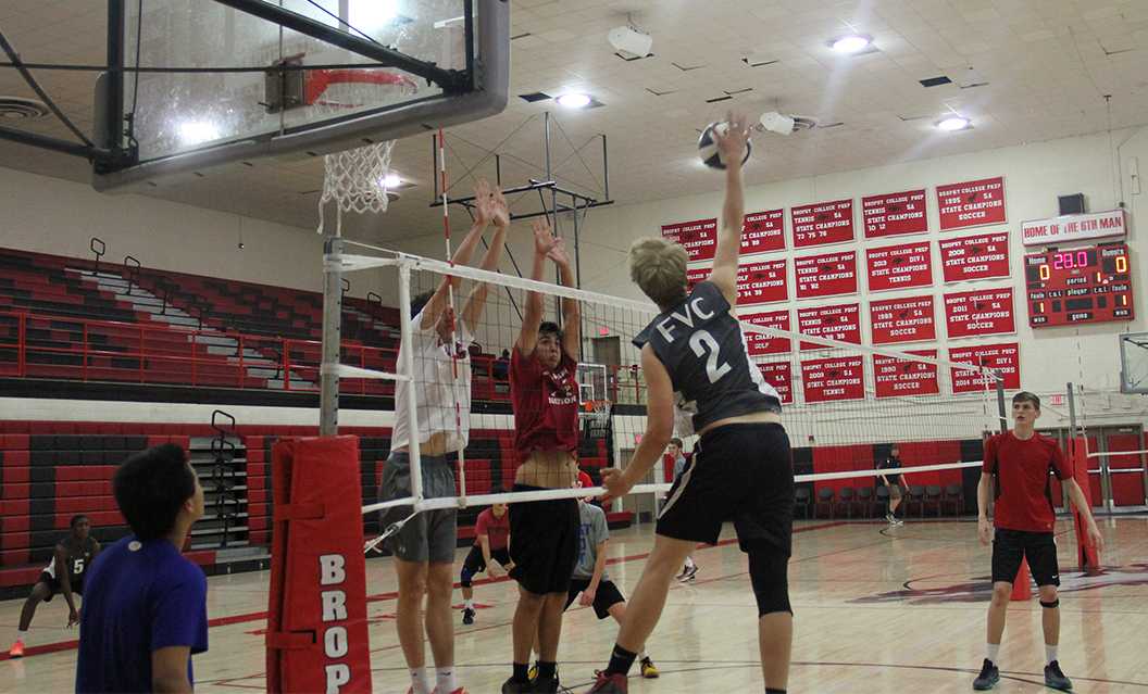 Photo by Andrew Brown ’18 - The volleyball team practices in the gym March 3. With a younger team, Coach Tony Oldani expects this to be a learning year for the team, with a more athletic roster than in past years.