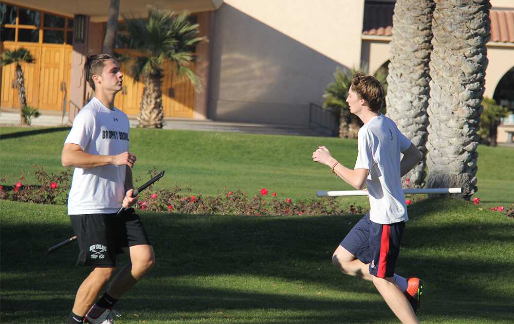 Photo by Charlie Register ’18 - Marcus Pimentel ’18 (left) and Charlie Albin (right) ’18 play Quidditch out on the front lawn of Brophy after school.