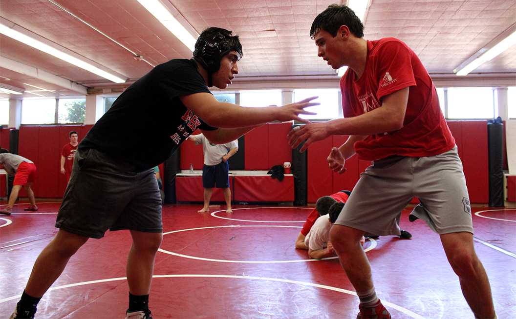 Photo by Cory Wyman ’16 - Hunter Talbo ’16 and Archie Garcia ’19 face off at wrestling practice. The wrestling team won 1st place at their sectional meet.