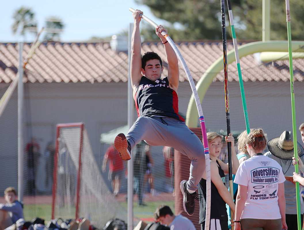 Photo by Bryce Owen ’17 | Carson Kurtz ’18 pole vaults at the Brophy home meet March 1. Kurtz originally got into pole vaulting after some friends joked that he should join, and it has turned into a positive and successful experience.