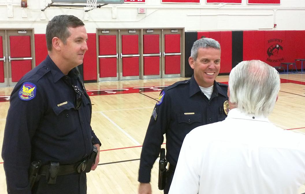Photo by Bryce Owen ’17 | Officers Brian Ross and Steve Mulligan of the Phoenix Police Department speak to Mr. Buchanan after a basketball game Feb. 21. Mr. Ross and Mulligan both secure many Brophy sporting events during the fall, winter, and spring sports seasons.