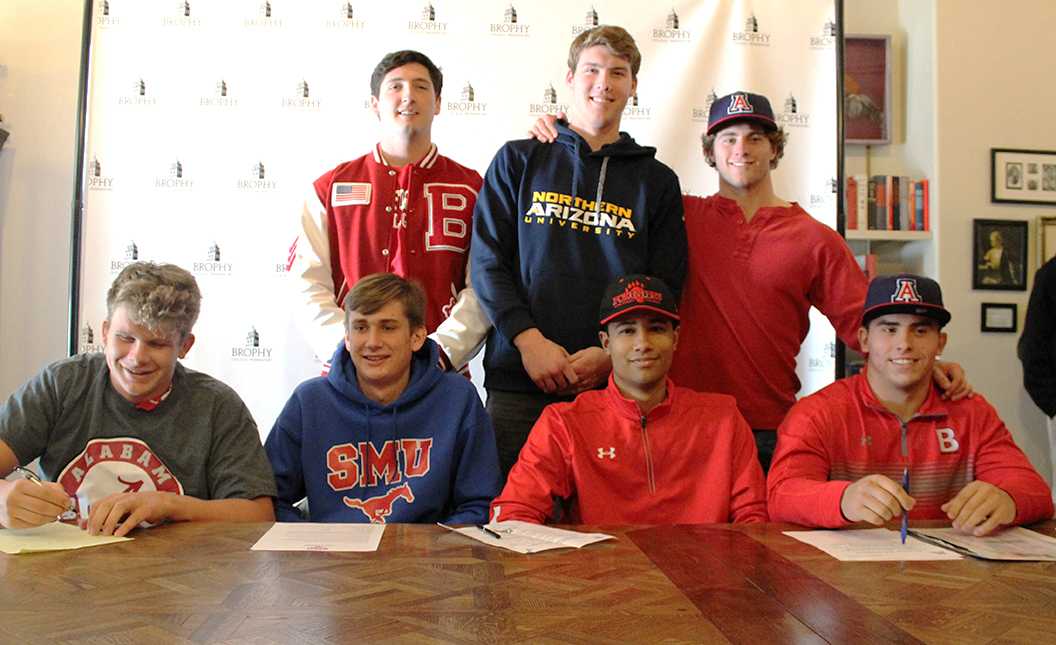 Photo by Ethan Broer ’19 | (Back row left ot right) Matt Leonard ’17, Matt Kempton ’17, Noah Pittenger ’17, (front row) Jack Blake ’17, Patrick Wintergalen ’17, Caleb Moore ’17 and  Rexx Tessler ’17 all pose for a photo after signing their letters of intent on National Signing day Feb. 1. Moore and Leonard will attend Lake Forest for football, Pittenger and Tessler will play football at U of A, Kempton will play basketball and football at NAU, Blake will swim at Alabama and Wintergalen will play soccer at SMU.