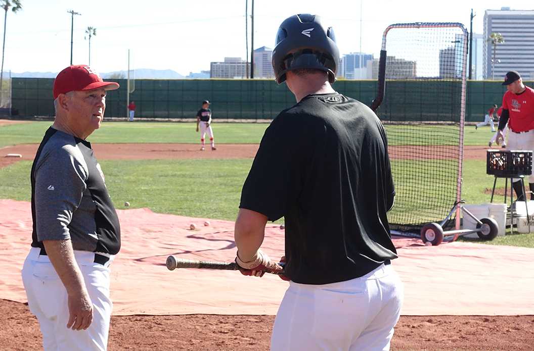 Photo by Hunter Franklin ’19 | Mr. Tom Succow instructs his team during batting practice Feb. 15. Succow is coaching his final season of a 40 year baseball coaching career at Brophy.