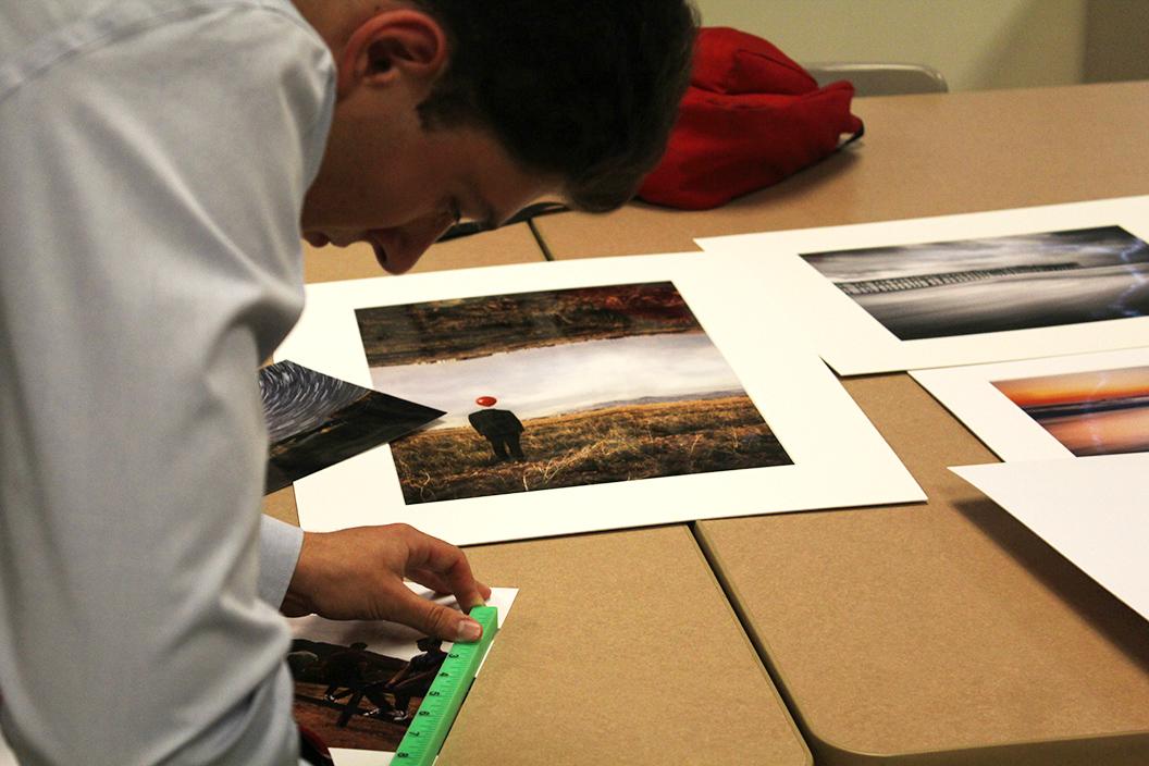 Photo by Andrew Brown ’18 | Will Alpert ’17 mounts a photo for AP Studio Art. Will has been named Man of the Year.