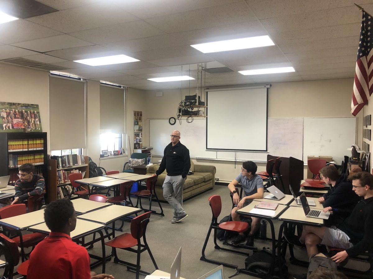 Mr. Jon Shores engages in a class discussion in his fifth period History of the Catholic Church class. Photo credit: Adrian Munguia