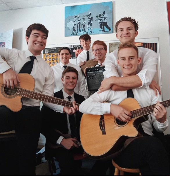 Members of the 2019 Brophy Mass band pose for a photo. This group of students originated the tradition of singing Reckless Love at school assemblies. 