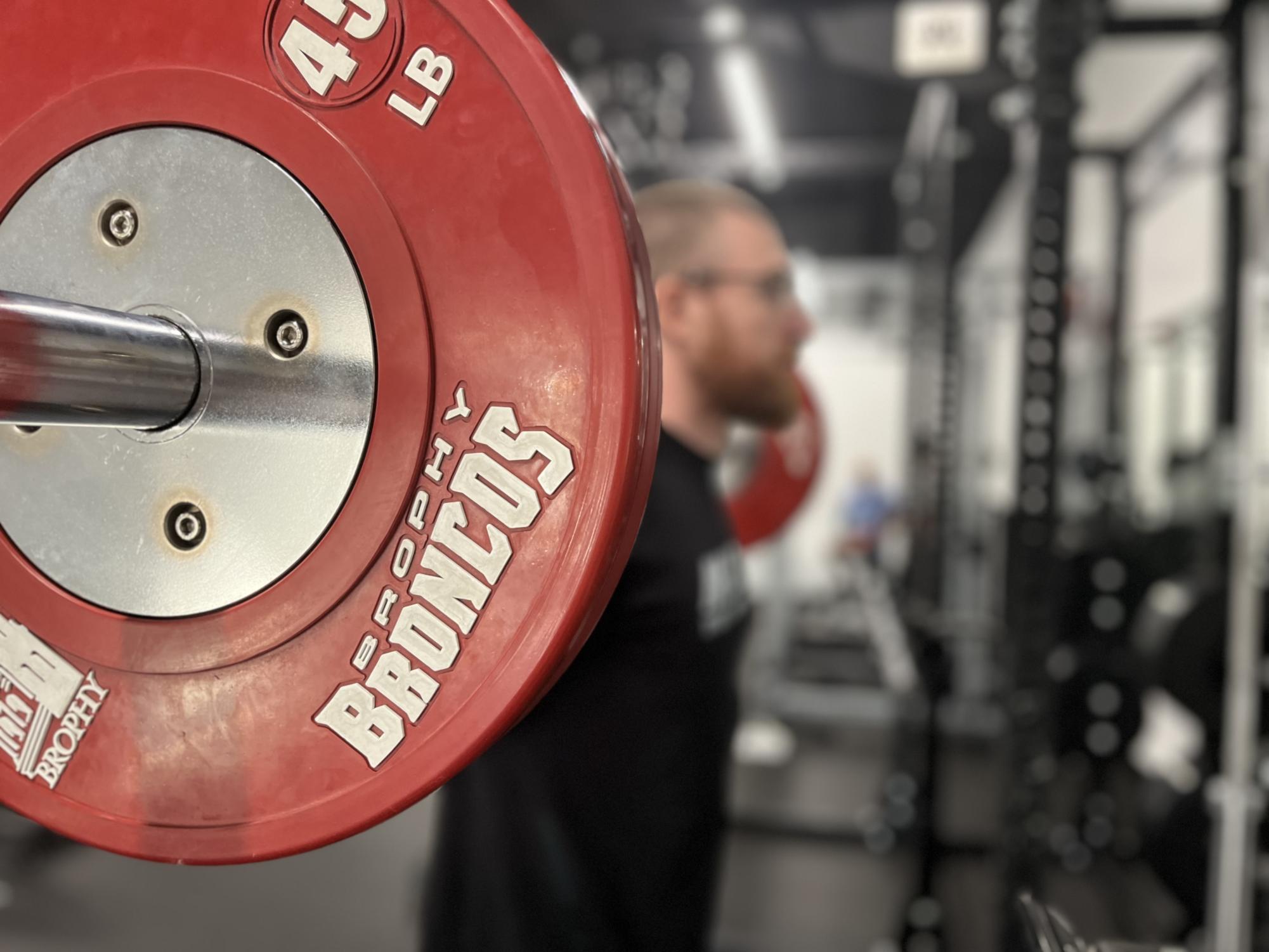 M1 Trainer Will Hannah using Brophy plates to back squat. 