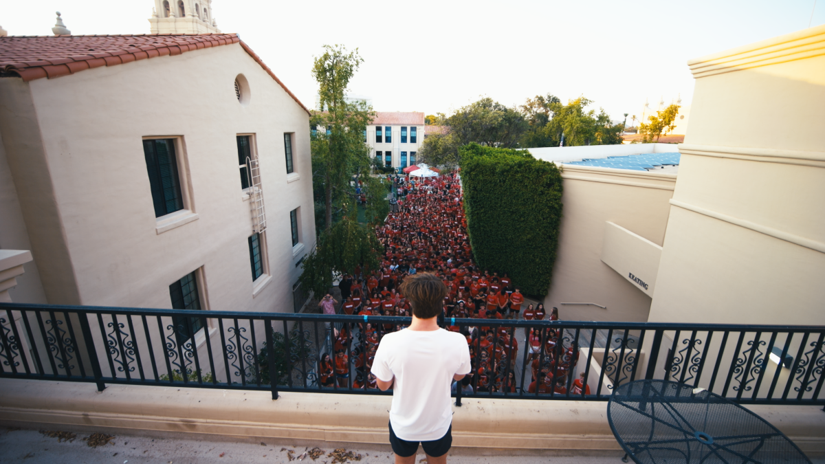 Grant Sonnenberg '25 leads Brophy to football game after tailgate.