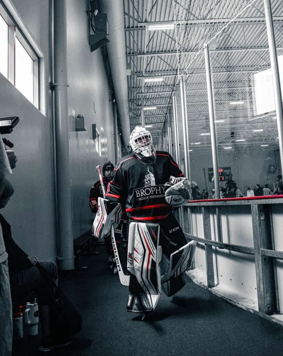Sawyer Reithinger ’27 walks towards the rink after a game against the Pinnacle Pioneers. 
