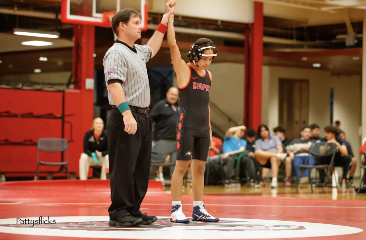 Luc Arreola’s hand is raised after a win in a match on Jan. 6, 2026
