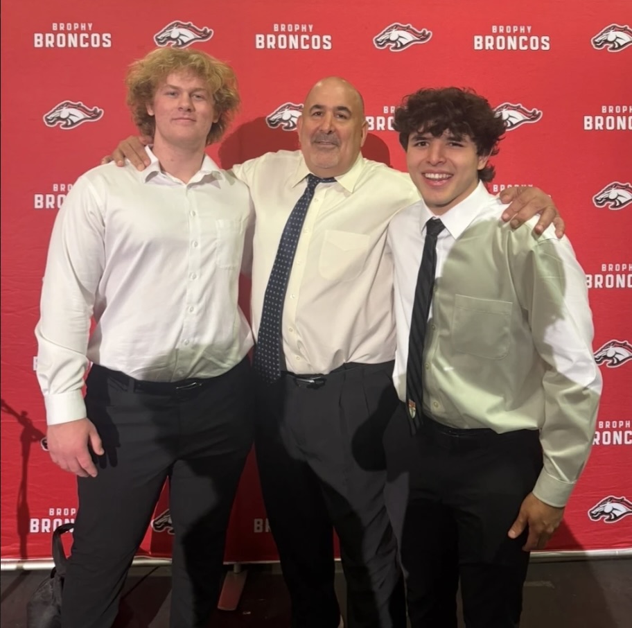 Photo courtesy Mr. Shaff.

Coach Catan poses for a photo with wrestlers Blake Sweetman ‘26 and Adam Angulo ‘26.